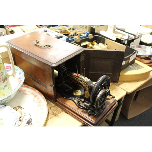 659 - A cased Singer sewing machine.