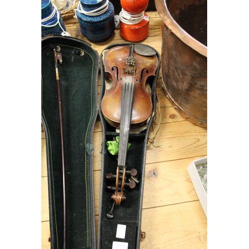 667 - Three violins, complete with cases.