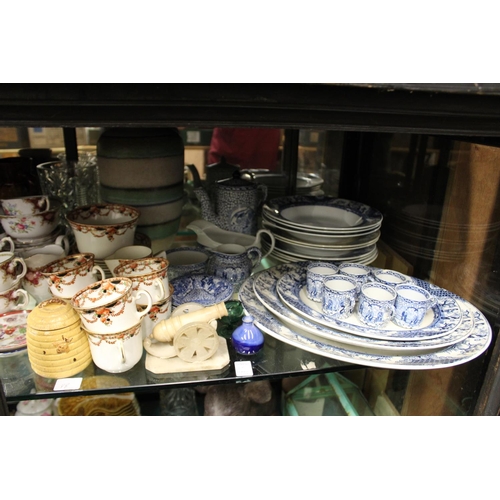 68 - A large shelf of decorative china, glassware etc.