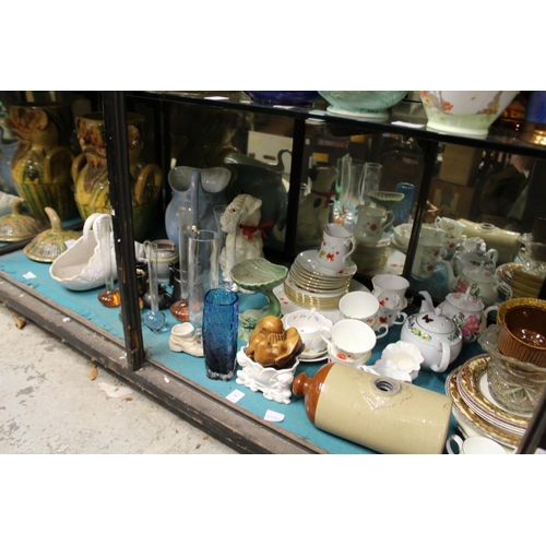 69 - A large shelf of decorative china, glass etc.