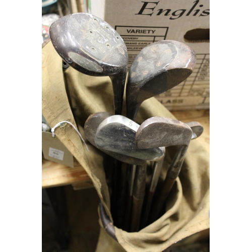 86 - Old golf clubs, a coal box etc.