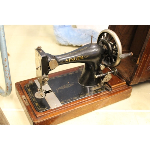 99 - A cased sewing machine.