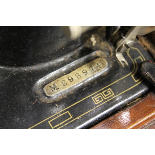 99 - A cased sewing machine.