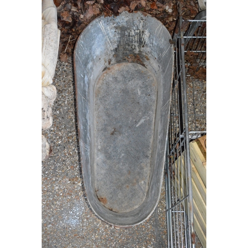 1 - A large galvanized bath tub.