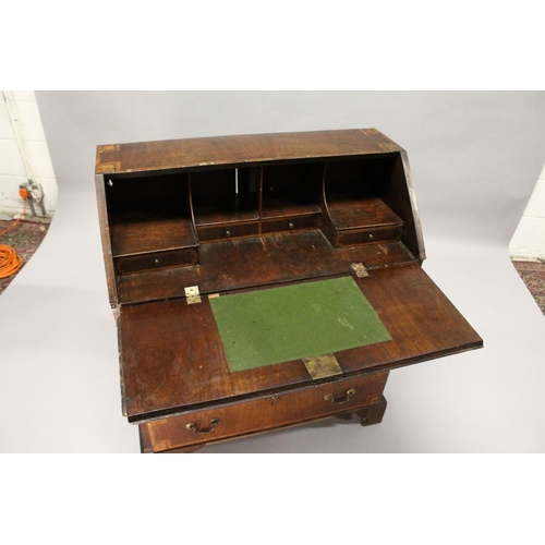 1002 - A GEORGE III MAHOGANY AND INLAID BUREAU, with a fall flap over three drawers, on bracket feet. 2ft 9... 