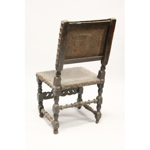 1005 - A 17TH CENTURY OAK SIDE CHAIR, with heavy brass studded embossed leather back and seat, turned legs ... 