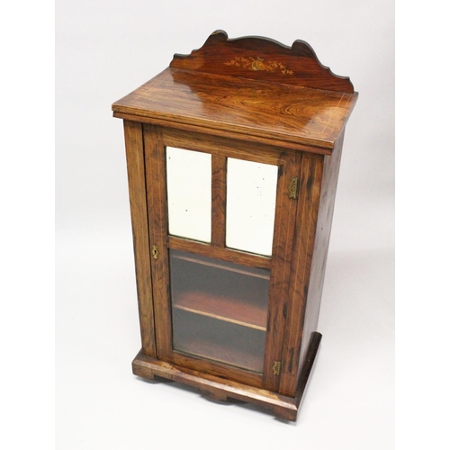 1018 - A VICTORIAN ROSEWOOD MUSIC CABINET, with a mirrored and glazed single door, on a plinth base with ca... 