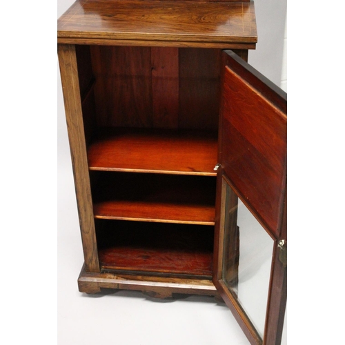 1018 - A VICTORIAN ROSEWOOD MUSIC CABINET, with a mirrored and glazed single door, on a plinth base with ca... 