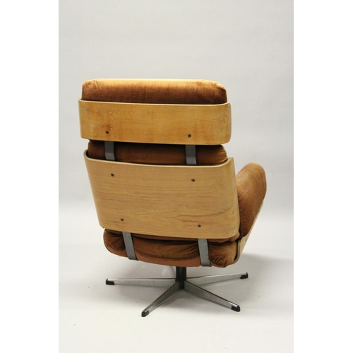 1019 - IN THE MANNER OF CHARLES EAMES, an office armchair, with brown draylon upholstered headrest, back an... 