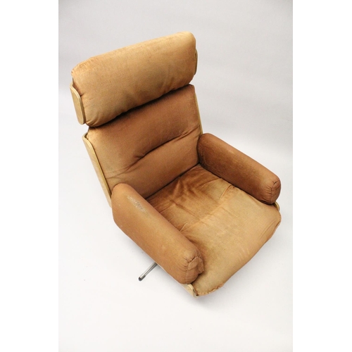 1019 - IN THE MANNER OF CHARLES EAMES, an office armchair, with brown draylon upholstered headrest, back an... 