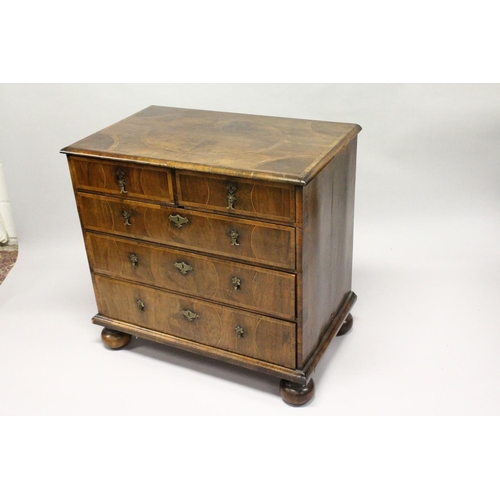 1022 - AN 18TH CENTURY WALNUT CHEST OF DRAWERS, with decoratively veneered top and drawers, boxwood stringi... 