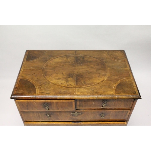 1022 - AN 18TH CENTURY WALNUT CHEST OF DRAWERS, with decoratively veneered top and drawers, boxwood stringi... 