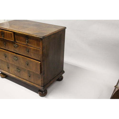 1022 - AN 18TH CENTURY WALNUT CHEST OF DRAWERS, with decoratively veneered top and drawers, boxwood stringi... 