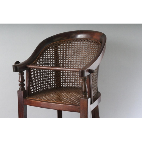 1034 - A 19TH CENTURY BERGERE STYLE HIGH CHAIR ON STAND. 2ft 8ins high.