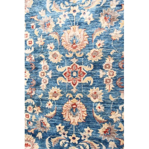 1042 - A ZIEGLER CARPET, 20th century, pale blue ground with stylised palmettes and floral decoration withi... 