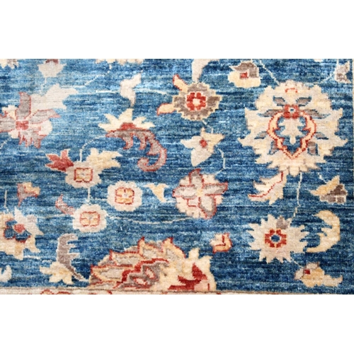 1042 - A ZIEGLER CARPET, 20th century, pale blue ground with stylised palmettes and floral decoration withi... 