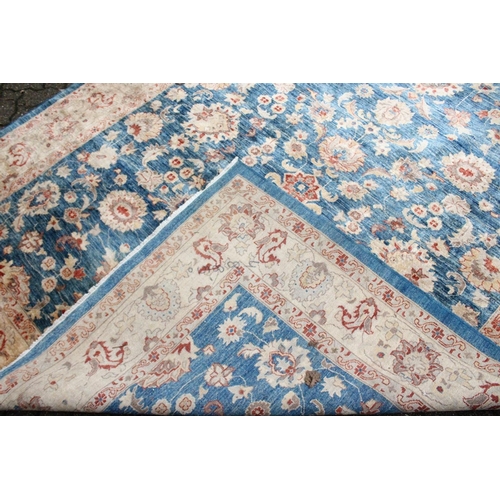 1042 - A ZIEGLER CARPET, 20th century, pale blue ground with stylised palmettes and floral decoration withi... 