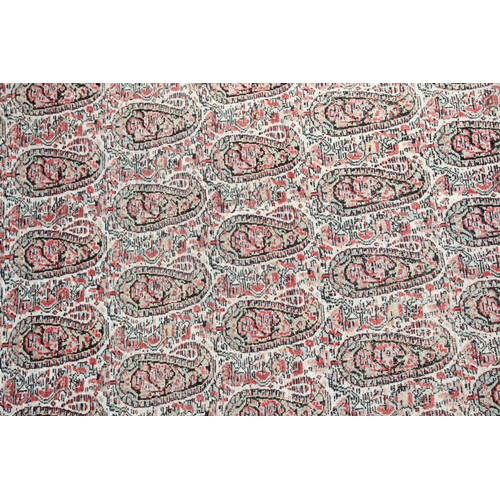 1043 - A PERSIAN SENNA RUG, early 20th century, beige ground with Boteh decoration within a red ground bord... 