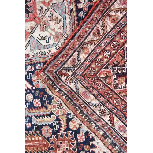 1044 - A PERSIAN QASHQAI RUG, early 20th century, dark blue ground with a central diamond shaped panel. 7ft... 