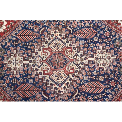 1046 - A GOOD SMALL QASHQAI RUG, early 20th century, cream ground central panel, stylised palmette design t... 