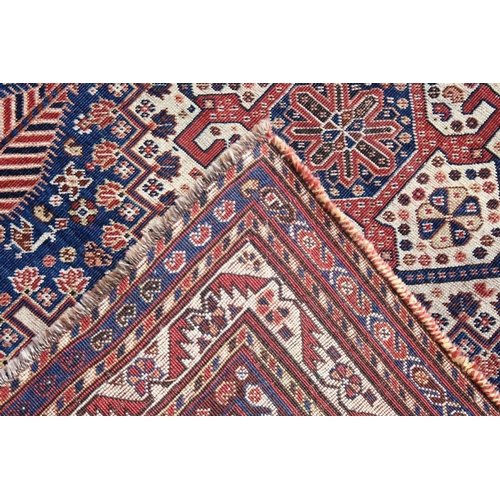 1046 - A GOOD SMALL QASHQAI RUG, early 20th century, cream ground central panel, stylised palmette design t... 