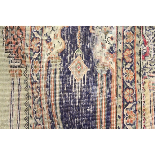 1047 - AN UNUSUAL PERSIAN PRAYER RUG, the central panel with eight arches and hanging lamps, within a geome... 