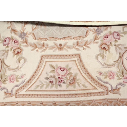 1049 - AN AUBUSSON STYLE TAPESTRY WALL HANGING, beige ground decorated with floral panels. 9ft 0ins x 6ft 0... 