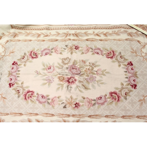 1049 - AN AUBUSSON STYLE TAPESTRY WALL HANGING, beige ground decorated with floral panels. 9ft 0ins x 6ft 0... 