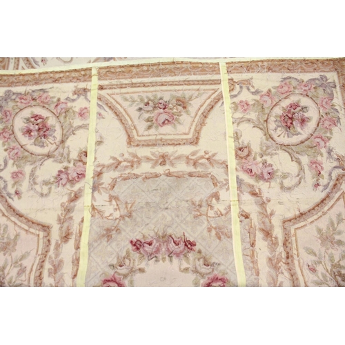 1049 - AN AUBUSSON STYLE TAPESTRY WALL HANGING, beige ground decorated with floral panels. 9ft 0ins x 6ft 0... 