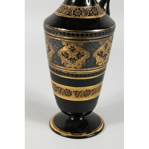 1062 - A CONTINENTAL DARK GREEN GLASS EWER AND STOPPER, with etched and gilded decoration. 14ins high.