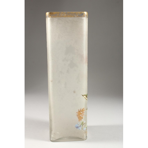 1064 - A FRENCH OPAQUE SQUARE SHAPED GLASS VASE painted with flowers. 11.75ins high.