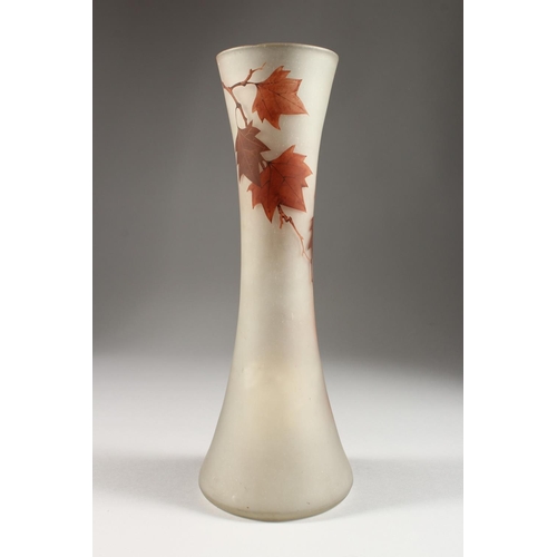 1065 - A FRENCH OPAQUE GLASS VASE, with waisted sides, painted in autumnal colours with leaves and berries,... 