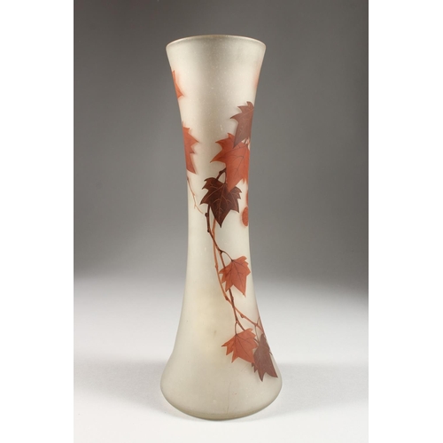 1065 - A FRENCH OPAQUE GLASS VASE, with waisted sides, painted in autumnal colours with leaves and berries,... 