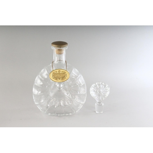 1074 - A BACCARAT CRYSTAL REMY MARTIN DECANTER AND STOPPER in a velvet box.