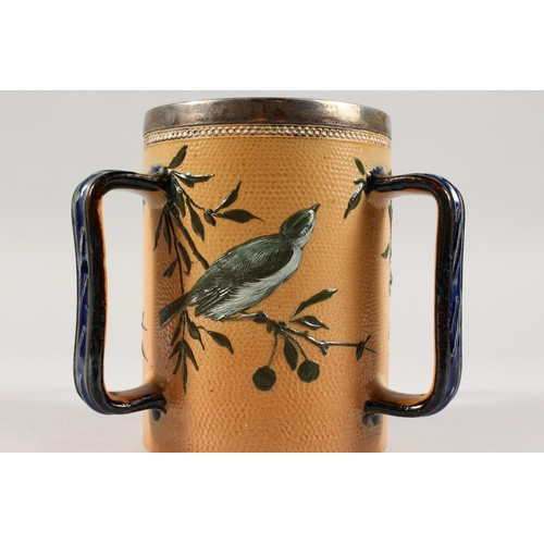 1077 - A GOOD DOULTON LAMBETH STONEWARE TYG by FLORENCE E. BARLOW decorated with birds. Maker F.E.B. Dated ... 