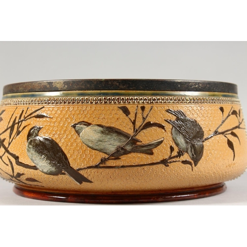 1081 - A LARGE DOULTON LAMBETH STONEWARE CIRCULAR FRUIT BOWL painted with birds. Maker F.E.B. No. 930. 1883... 