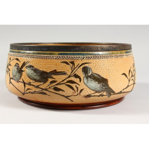 1081 - A LARGE DOULTON LAMBETH STONEWARE CIRCULAR FRUIT BOWL painted with birds. Maker F.E.B. No. 930. 1883... 