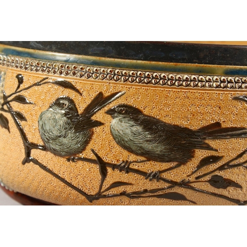 1081 - A LARGE DOULTON LAMBETH STONEWARE CIRCULAR FRUIT BOWL painted with birds. Maker F.E.B. No. 930. 1883... 