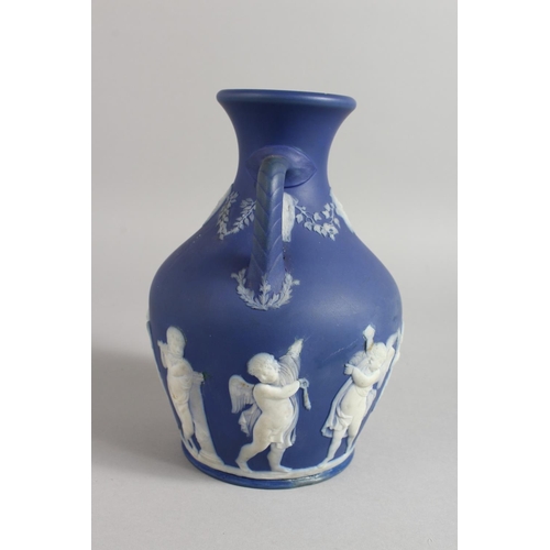 1125 - A BLUE JASPER WARE TWO HANDLED PORTLAND VASE. 7.5ins high.