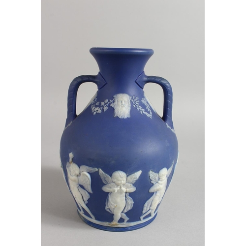 1125 - A BLUE JASPER WARE TWO HANDLED PORTLAND VASE. 7.5ins high.