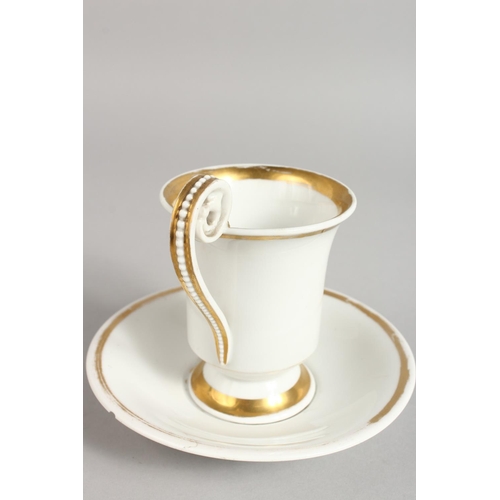 1130 - A BERLIN ARMORIAL CUP AND SAUCER.