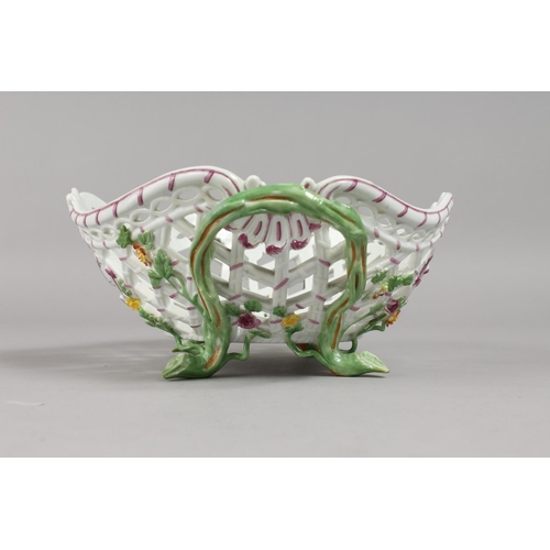 1133 - A GOOD MEISSEN OVAL PIERCED TWO-HANDLED BASKET, painted and encrusted with flowers with rustic handl... 