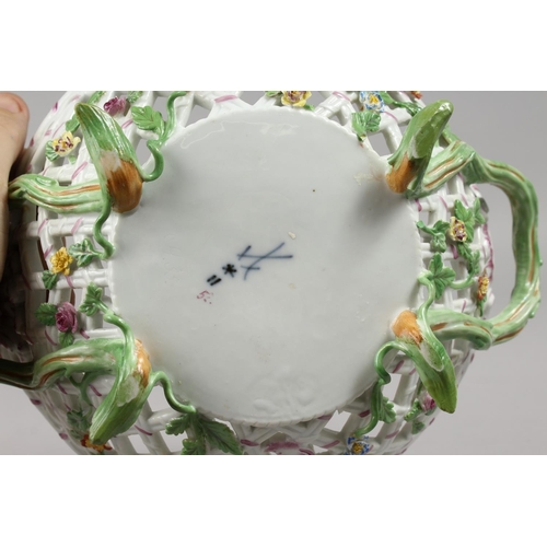 1133 - A GOOD MEISSEN OVAL PIERCED TWO-HANDLED BASKET, painted and encrusted with flowers with rustic handl... 