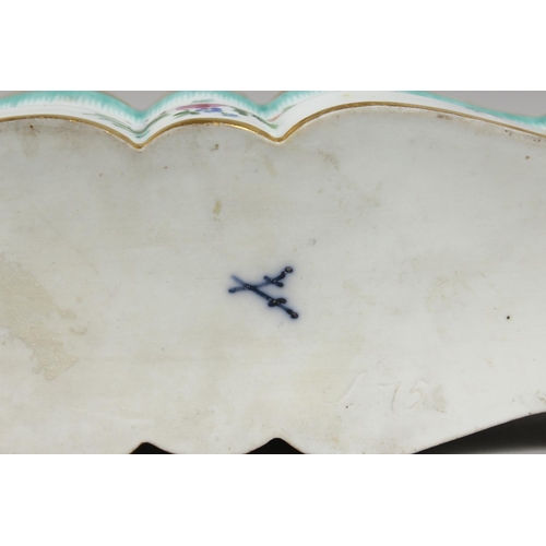 1139 - A RARE MEISSEN LONG INKWELL painted with flowers. Cross swords mark in blue.  10.75ins long.