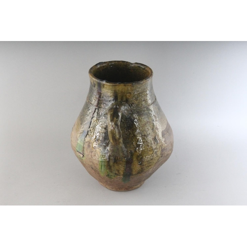 1150 - AN 18TH CENTURY TWIN HANDLED GREEN OCHRE GLAZED POT. 10.5ins high.