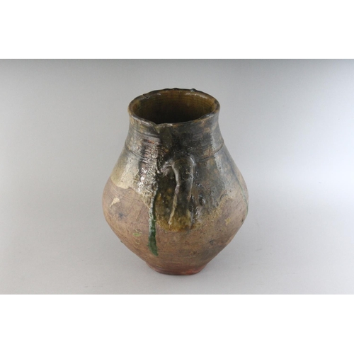 1150 - AN 18TH CENTURY TWIN HANDLED GREEN OCHRE GLAZED POT. 10.5ins high.