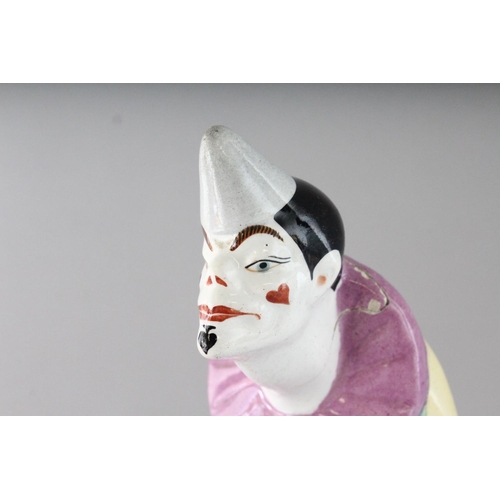 1156 - AN ART DECO DESIGN POTTERY CLOWN. 14ins high.