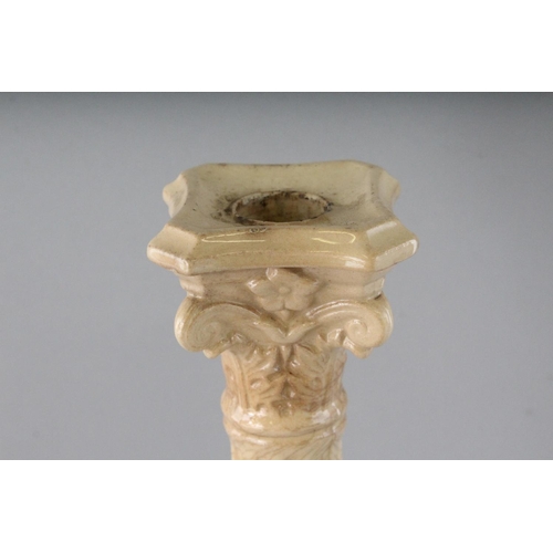 1157 - TWO CREAMWARE CORINTHIAN COLUMN CANDLESTICKS. 12ins high.