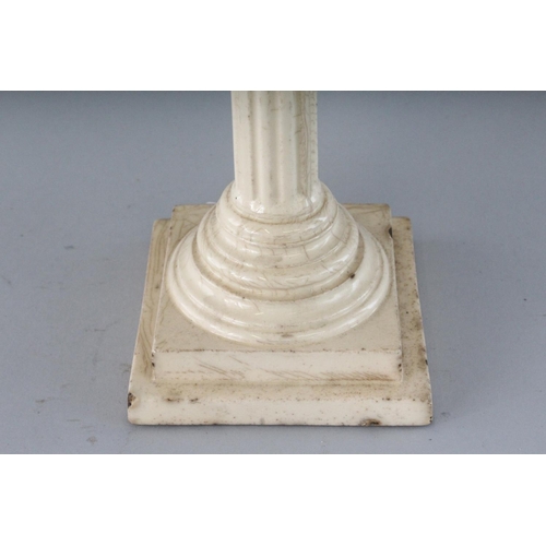 1157 - TWO CREAMWARE CORINTHIAN COLUMN CANDLESTICKS. 12ins high.