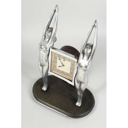 1171 - AN ART DECO CHROME PLATED ELECTRIC MANTLE CLOCK, by Genalex, with a square dial suspended between tw... 